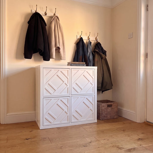 IKEA Kallax Centred overlay in white on solid cube doors in a hallway — The Upscale Collection