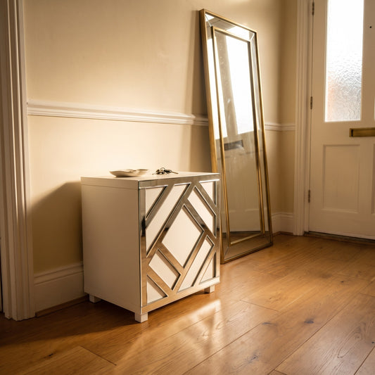 Silver mirror Criss Cross acrylic overlay on an IKEA Kallax cube in a warm hallway