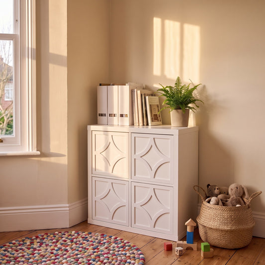 IKEA Kallax Diamond overlay in white on solid cube doors in a playroom — The Upscale Collection