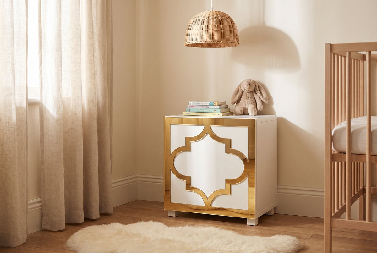 Gold mirror Arabesque acrylic overlay on an IKEA Kallax cube in a warm nursery