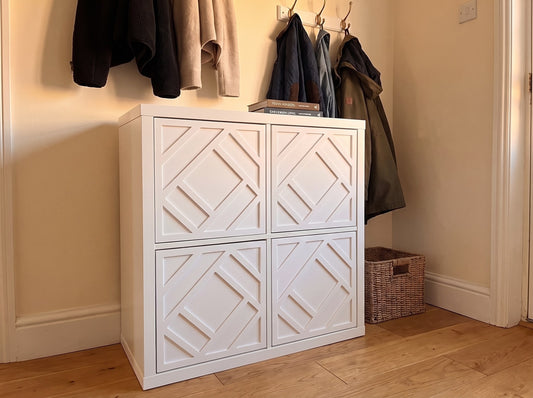 IKEA Kallax Centred overlay in white on solid cube doors in a hallway — The Upscale Collection