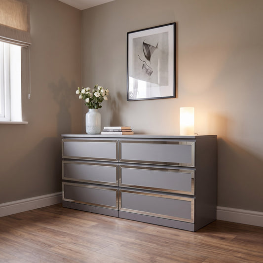 Silver mirror Framed acrylic overlays on a grey IKEA Malm chest in a warm bedroom
